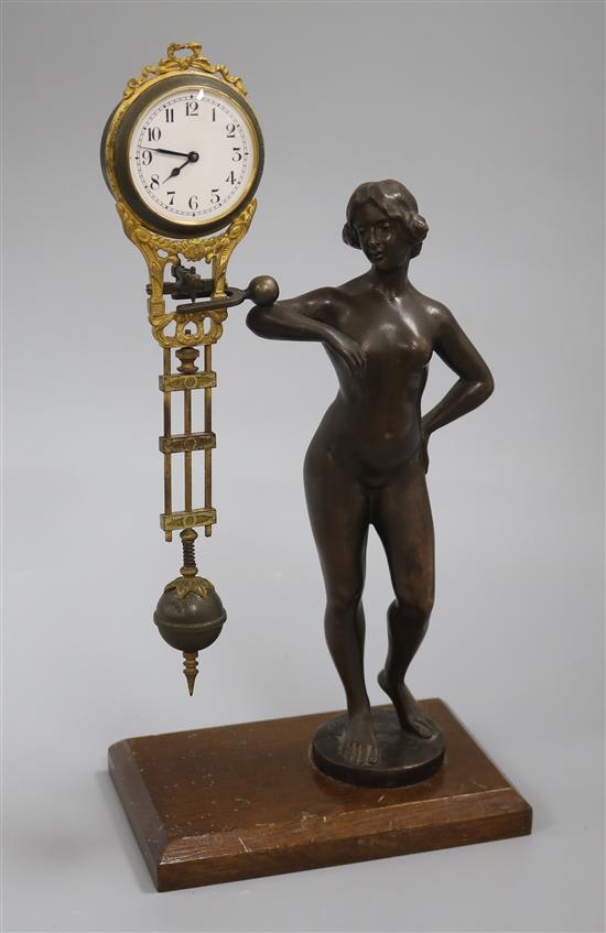 A late 19th century German bronze mystery timepiece, height 11.75in.
